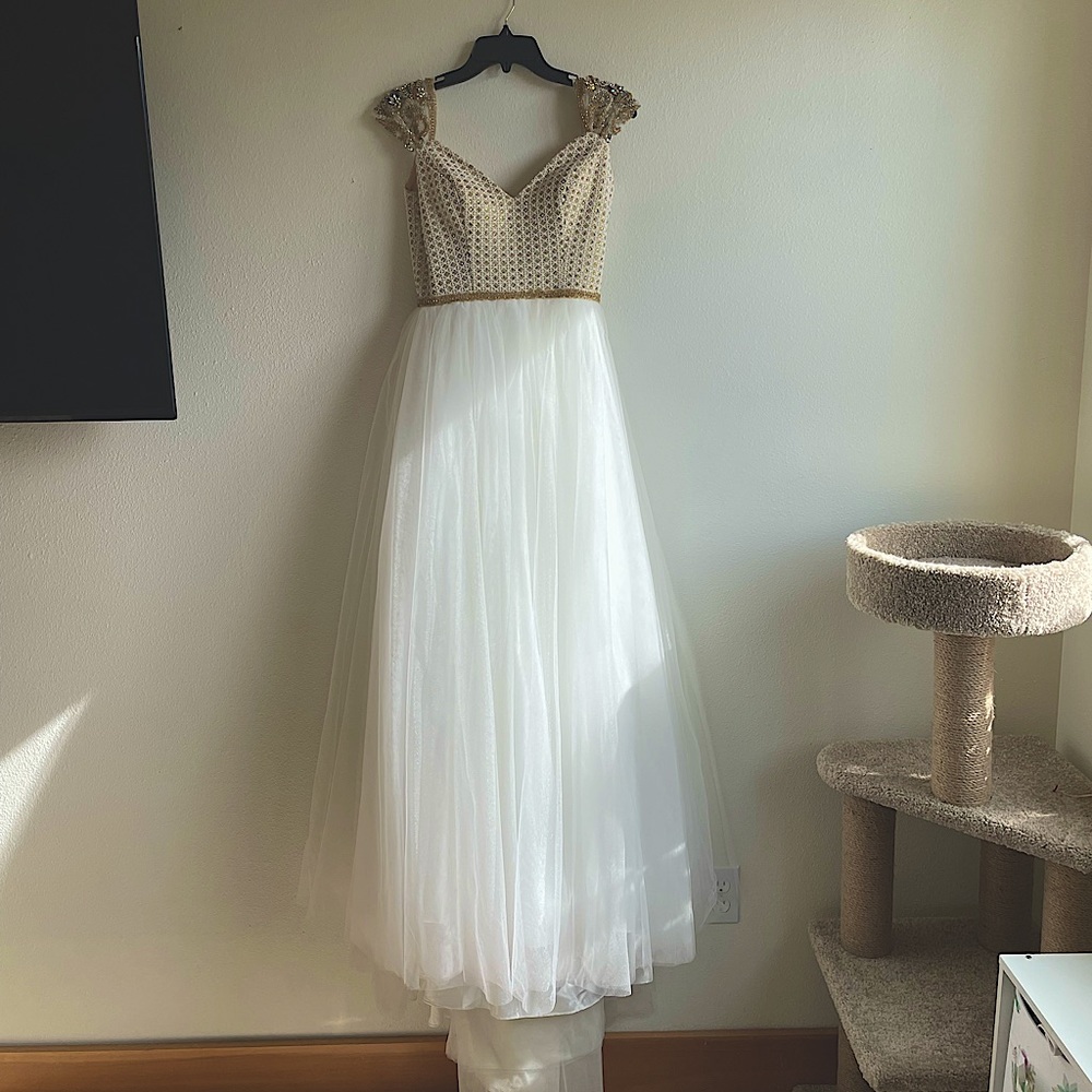 Floor length gold and white dress with train